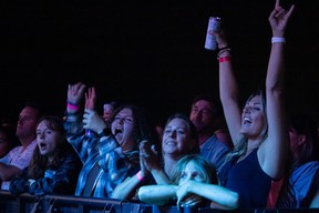 People cheer for the supergroup Trans-Canada Highwaymen at Wood Buffalo Ribfest in Fort McMurray on September 1, 2023. Vincent McDermott/Fort McMurray Today/Postmedia Network