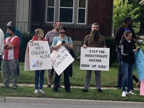 People protesting "gender-affirming policies" in schools are shown outside the Thames Valley District school board headquarters on Dundas Street. Photo taken Sept. 20, 2023. (Derek Ruttan/The London Free Press)
