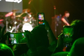 People use their phones to record a Trooper concert at Wood Buffalo Ribfest in Fort McMurray on September 3, 2023. Vincent McDermott/Fort McMurray Today/Postmedia Network