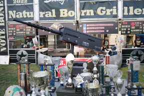 Trophies and a fake machine gun outside Natural Born Grillers at Wood Buffalo Ribfest in Fort McMurray on August 31, 2023. Vincent McDermott/Fort McMurray Today/Postmedia Network