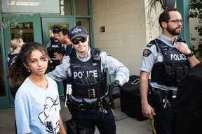 Police officers stop protesters from entering the Fort McMurray Public School Division during the 1 Million March 4 Children on September 20, 2023. Vincent McDermott/Fort McMurray Today/Postmedia Network