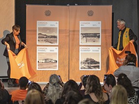 Heather George, executive director of the Woodland Cultural Centre in Brantford and Dale Leclair, Director of Indigenous and Northern Affairs for Canada Post unveil four new stamps in the second annual Truth and Reconciliation series on Wednesday September 27, 2023 in Brantford, Ontario.