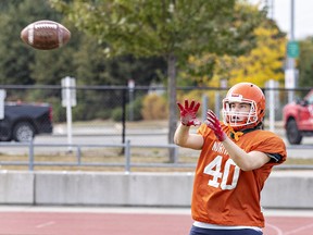 Micah DuChene of the North Park Trojans gets set to receive a pass during a high school senior boys football practice on Monday. Brian Thompson/Brantford Expositor/Postmedia Network