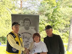 The Gananoque Lions Club presented two cheques to the Terry Fox organization in the amount of $500 each at the runs in Rockport and Gananoque on September 17. Here Lisa Marie Vincent accepts a cheque from Lions (l) Don Millar and (r) John MacLeod at the Terry Fox Run held in Rockport. supplied by Thomas Hopkins