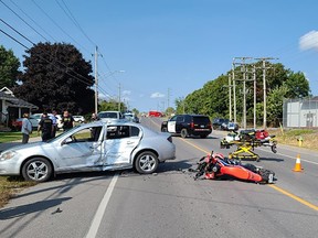 Ontario Provincial Police investigate a collision between a car and a motorcyclist each operated by Napanee District Secondary School students in Napanee, Ont., on Friday, September 22, 2023. Both students were taken to hospital, one, the motorcyclist, with major injuries.