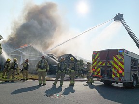 Kingston Fire and Rescue respond to a house fire on Clover Street in Kingston, Ont., on Monday, September 25, 2023.