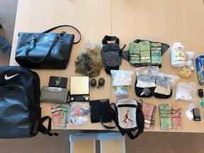 Drugs, cash, and other items that were seized by the Kingston Police in Kingston, Ont., on Thursday, September 21, 2023. Two people have been arrested for drug trafficking.