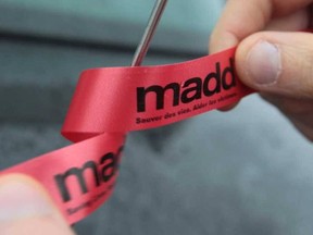 A MADD Canada ribbon is pictured during its red ribbon campaign promoting sober driving in this file photo.
