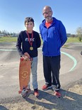 Dawson Cullen, left, placed first in the skills competition (ages 12 to 14) Saturday and received a Madd Gear skateboard as his prize from Mayerthorpe FCSS Director Duncan Milloy. The skills competition was held as part of the 2023 Hotwheels Competition, held at the pump track (BMX and Skateboard Park). This was the second year for the event.