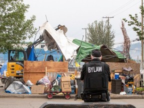 This photo was taken on Sept. 11 during demolition of the homeless encampment at Prince George's Millennium Park. Residents of the camp were ordered to leave by Sept. 9.  Photo credit: Steven Dubas