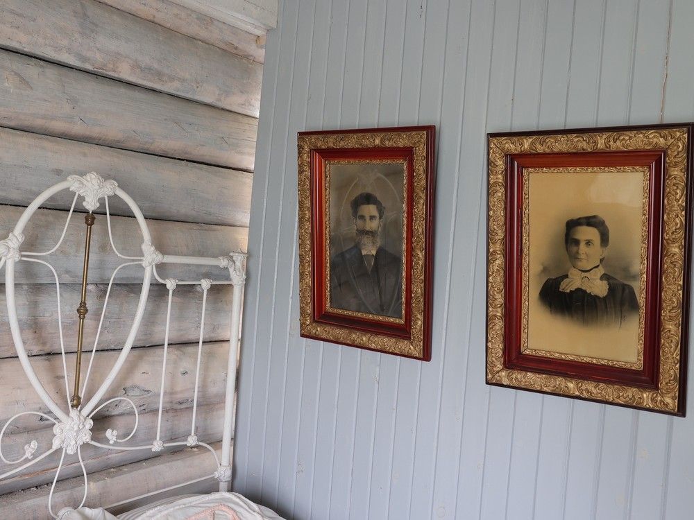 Antique photos hanging on a museum wall