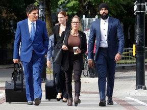 Tamara Lich walks to court in Ottawa with her lawyer Lawrence Greenspon, on Sept 7.