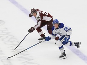 David Goyette, front, of the Sudbury Wolves, and Jax Dubois, of the Peterborough Petes, chase down the puck during OHL preseason action at the Sudbury Community Arena in Sudbury, Ont. on Friday September 8, 2023.