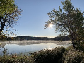 Mist hovers over McCharles Lake in Naughton, Ont. as the sun rises.