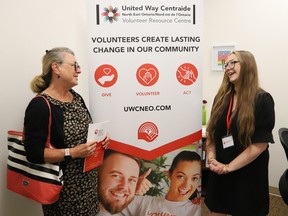 Karen Makela, left, board member of United Way Centraide North East Ontario, chats with Megan Karchie, program coordinator of United Way's new Volunteer Resource Centre