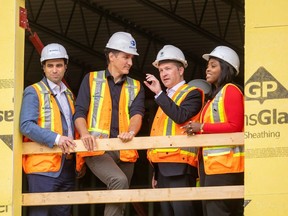 Prime Minister Justin Trudeau, second from left, is shown in London, Ont. this week inspecting an accessible housing project alongside local politicians.