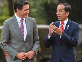 Indonesia's President Joko Widodo (R) speaks with Canada's Prime Minister Justin Trudeau as they walk before holding a bilateral meeting at the presidential palace in Jakarta on Sept. 5, 2023. (Photo by ADEK BERRY / AFP) (Photo by ADEK BERRY/AFP via Getty Images)