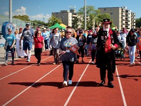 Brantford Town Crier David McKee led the way at the Grand River Council on Aging Grand Parade held at Kiwanis Field on Sept. 16. The event attracted more than 80 participants and raised $25,000 to support the council's efforts to ensure older adults remain connected to the community. Vincent Ball