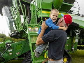 Child and father by combine