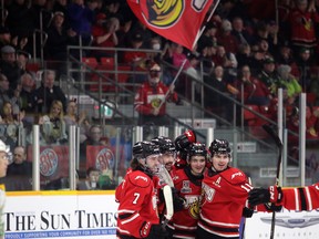 The Owen Sound Attack celebrate following Cedrick Guindon's goal in the first period as the Owen Sound Attack host the London Knights in Game 3 of their Western Conference quarterfinal series at the Harry Lumley Bayshore Community Centre on Tuesday, April 4, 2023. Greg Cowan/The Sun Times