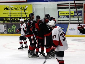 The Whitecourt Wolverines, including Elijah Brown and Rodion Tatarenko, celebrated their first goal of the season, made by Joey Melo (assisted by Tatarenko and Nathaniel Bannister).