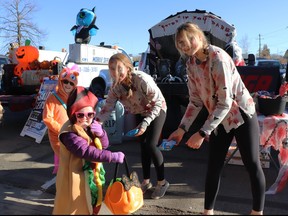 Jaelyn and Jocelyn Thomas scored some treats from IGA's Megan and Isabelle Davio during Trunk or Treat in Whitecourt in 2022. Council approved the event again for 2023.