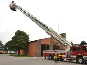 Recently firefighters train on the Stratford Fire Department's ladder truck in front of the city's McCarthy Road fire station Oct. 5.