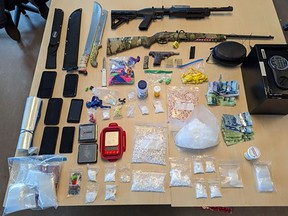 Illicit substances, weapons and firearms seized by Kingston Police as part of a drug trafficking investigation in Kingston, Ont., on Wednesday, October 11, 2023. (Supplied by Kingston Police)