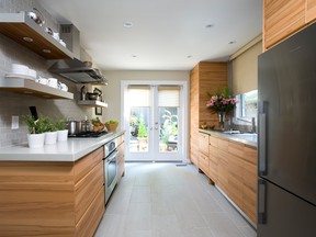 KITCHEN LAYOUTS: A galley kitchen is long and narrow with a door at one end, and typically arranged with two rows of cupboards and a sink below the window.