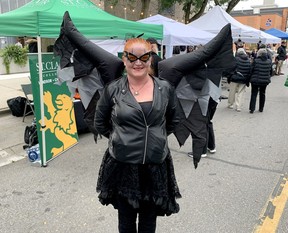 Chatham resident Sarah Pike had no problem pulling together a crow outfit to wear to Crowfest in downtown Chatham Friday. (Ellwood Shreve/Chatham Daily News)