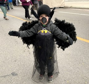 Walter George, 5, of Chatham, shows off his crow costume during Crowfest in downtown Chatham Friday. (Ellwood Shreve/Chatham Daily News)