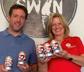 Black Swan Brewing owner Ryan Stokes and United Way Perth-Huron Stratford-area manager of community development Elizabeth Cooper show off Black Swan's new Local Love Cream Ale. Fifty cents from every can will go back to the local United Way's annual fundraising campaign.