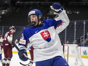 Slovakia's Dalibor Dvorsky (15) celebrates a goal against Latvia during second period IIHF World Junior Hockey Championship action in Edmonton on Friday August 12, 2022.