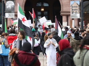 Protesters from TMU and University of Toronto make their feelings known about the attacks in the Middle East on Oct. 20 at Queen's Park in Toronto.