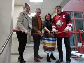 Caroline Lidstone-Jones, chief executive of the Indigenous Primary Health Care Council, left; London deputy mayor Shawn Lewis; Bonnie Smith, integrated care manager for Southwest Ontario Aboriginal Health Access Centre; and centre chief executive Brian Dokis cut the ribbon at the opening ceremony of the new location of the centre's London clinic at 493 Dundas St. on Wednesday, Oct. 25, 2023. (Jack Moulton/The London Free Press)