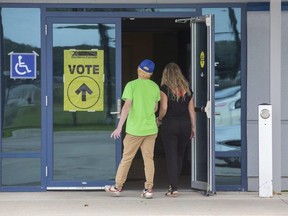Voters enter the polling station at the Cosgrove Hockey Academy in St. Thomas in the Elgin-Middlsex-London riding on the day of the federal election, Sept. 20, 2021. (Derek Ruttan/The London Free Press)