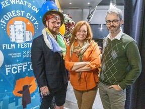 Filmmaker Kevin Andrew Heslop, left, Forest City Film Festival executive director Dorothy Downs and Andrew Dodd, manager of Film London, pose for a photo at the festival launch party at Olive R. Twist’s in London on Thursday, Sept. 14, 2023. (Derek Ruttan/London Free Press)