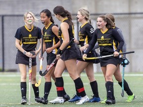 Central Elgin players celebrate after Gillan Rae (second from left) scores the lone goal of the game in their high school field hockey game against Saunders at City Wide Sports Park in London on Tuesday, Oct. 10, 2023. (Derek Ruttan/The London Free Press)