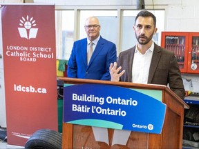 Elgin-Middlesex-London MPP Rob Flack listens to Ontario's education minister, Stephen Lecce, at the announcement of a new Catholic high school in London on Thursday Oct. 12, 2023. (Derek Ruttan/ The London Free Press)