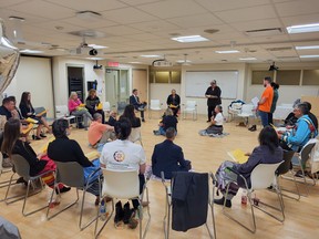 Members of the Maamwesying Ontario Health Team and Health Sciences North take part in a blanket exercise during Thursday's collaboration agreement signing ceremony in Sudbury.