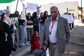 Councillor Shafiq Dogar visits protesters supporting Palestine rally on Franklin Avenue in downtown Fort McMurray on October 10, 2023. Vincent McDermott/Fort McMurray Today/Postmedia Network