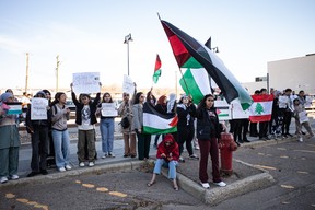 Protesters supporting Palestine rally on Franklin Avenue in downtown Fort McMurray on October 10, 2023. Vincent McDermott/Fort McMurray Today/Postmedia Network