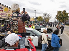 Mary Lollar takes a photo of the Main Street crowd
