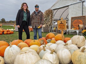Jessica Durka and farm operator Andrew Sloot stand outside the JCC Pumpkin Patch Event on Cockshutt Road where proceeds from sales will go to the Juravinski Cancer Centre in Hamilton.