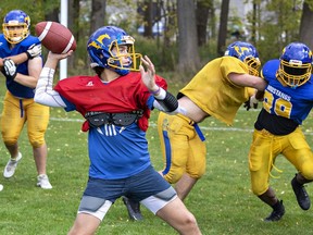 BCI Mustangs quarterback Andrew Nemeth winds up to pass the ball during a practice for the senior boys team on Wednesday October 18, 2023 at Waterworks Park in Brantford, Ontario. Brian Thompson/Brantford Expositor/Postmedia Network