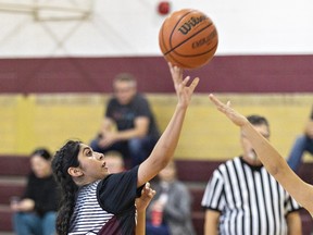 Laiba Iqbal (left) of the Pauline Johnson Thunderbirds takes a shot at the hoop during an AABHN high school senior girls basketball game against the BCI Mustangs on Tuesday October 24, 2023 in Brantford, Ontario. Brian Thompson/Brantford Expositor/Postmedia Network