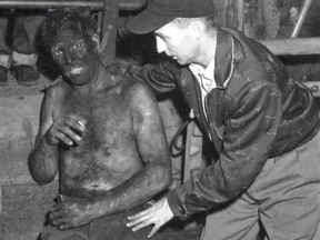 A rescued miner pulled from the rubble after the 1958 Springhill mine disaster