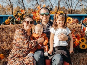 A young family at a fall festival