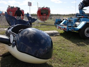 A ride at the Brigden Fair that officials say broke and fell Friday with children riding on it sat mostly disassembled at the fairgrounds Sunday.