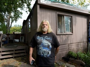 Darrell Goodlet was homeless before he moved into this trailer in a Simcoe trailer park 10 years ago. Now he and his cat, Jigsaw, are facing eviction.